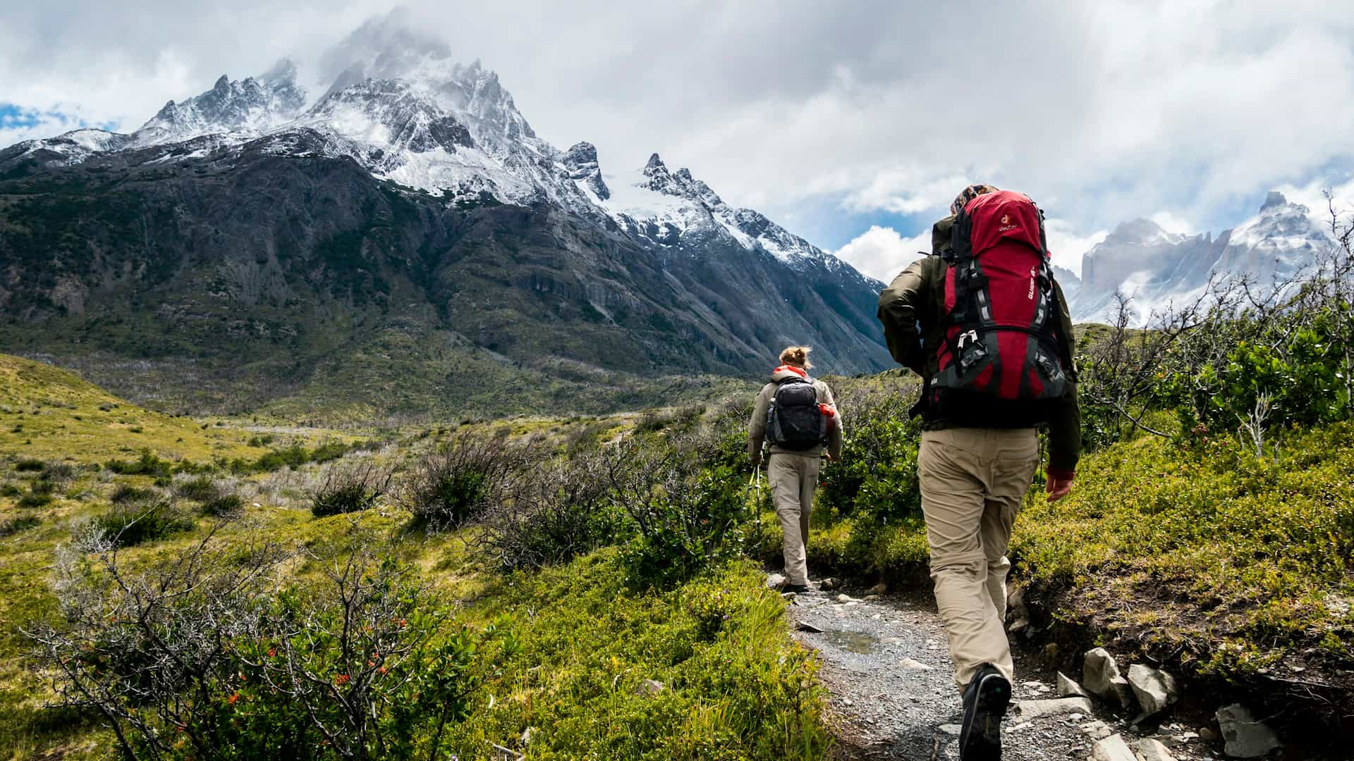 Hikers on a mountain trail at sunrise